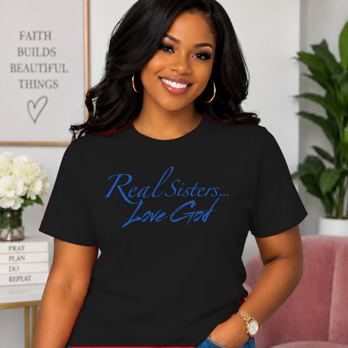 Model wearing Black Real Sisters Love God T-shirt with Blue lettering, crisp original logo