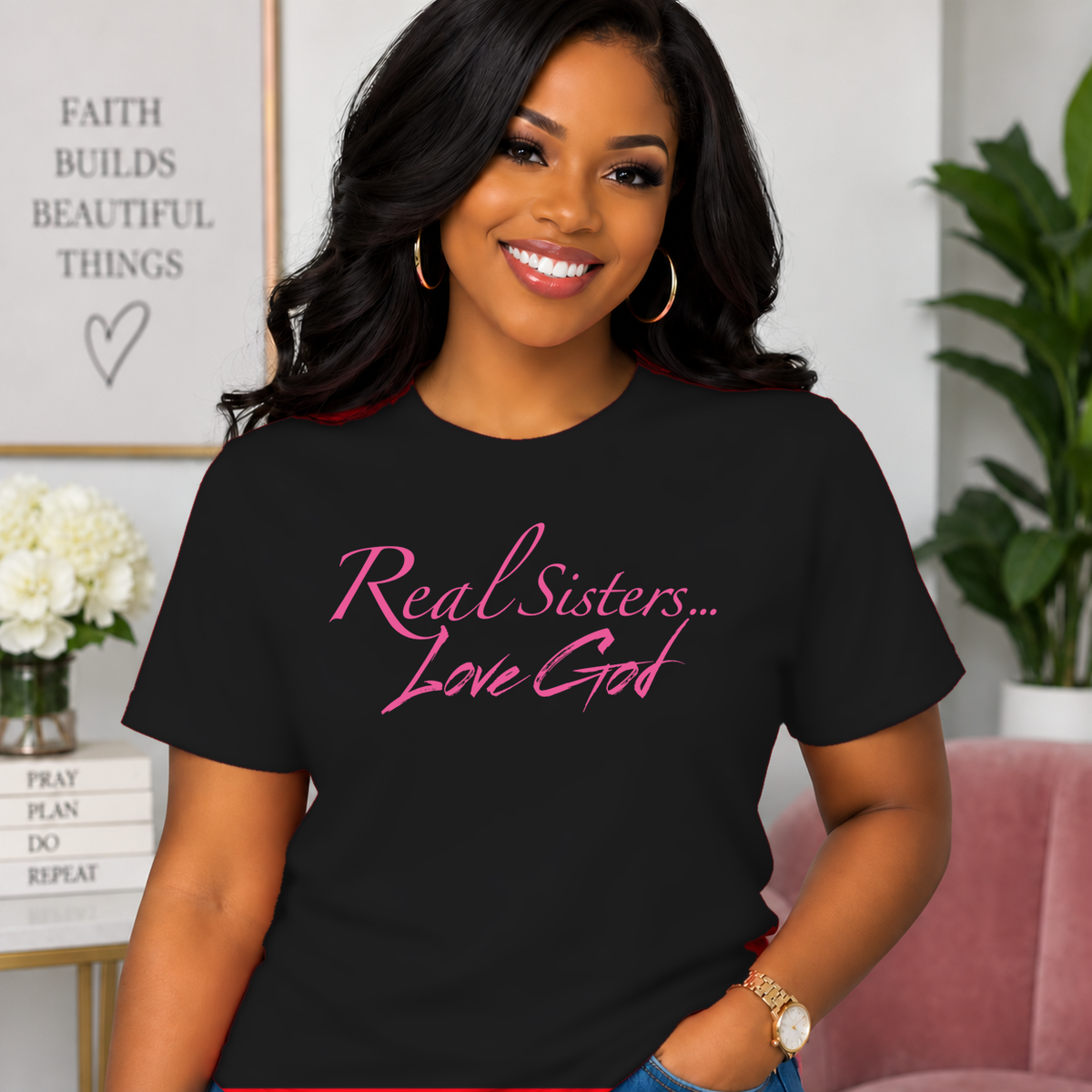 Model wearing Black Real Sisters Love God T-shirt with Pink lettering, crisp original logo