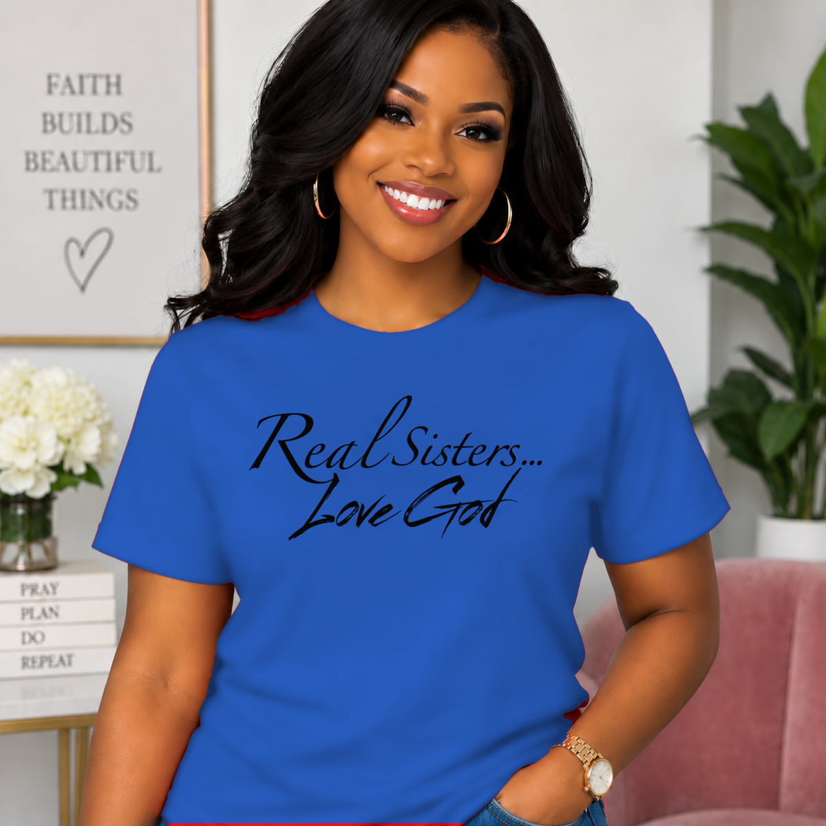 Model wearing Blue Real Sisters Love God T-shirt with Black lettering, crisp original logo