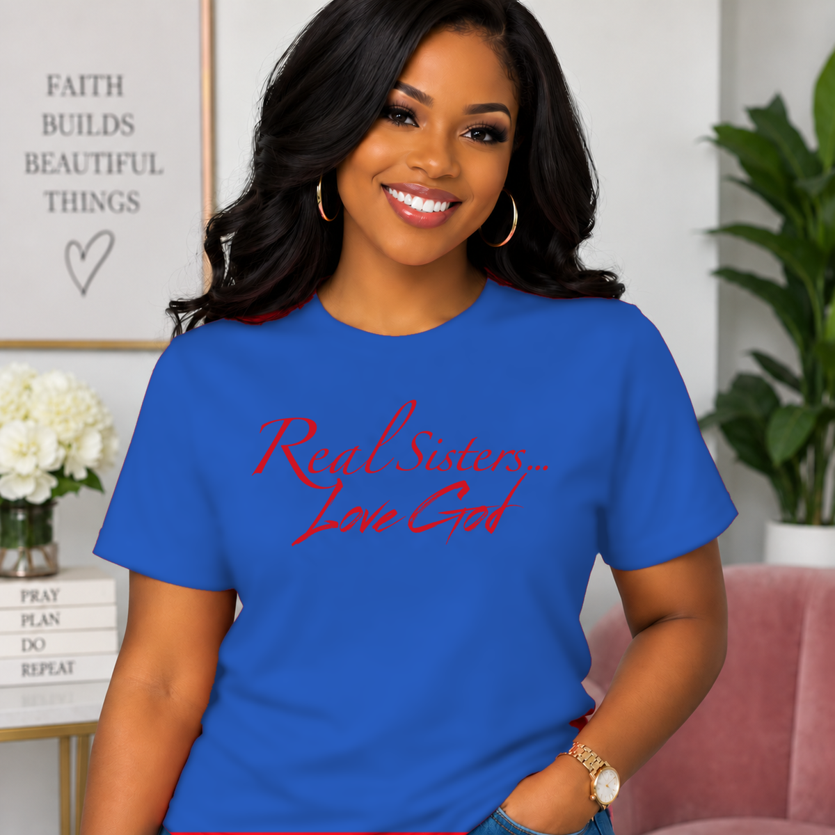 Model wearing Blue Real Sisters Love God T-shirt with Red lettering, crisp original logo