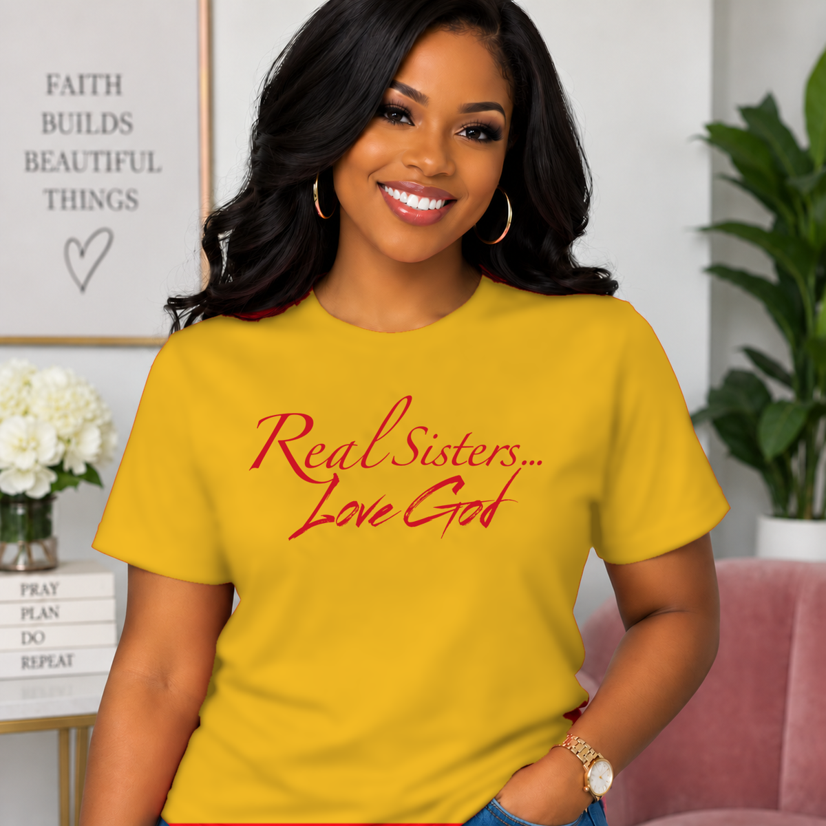 Model wearing Gold Real Sisters Love God T-shirt with Red lettering, crisp original logo