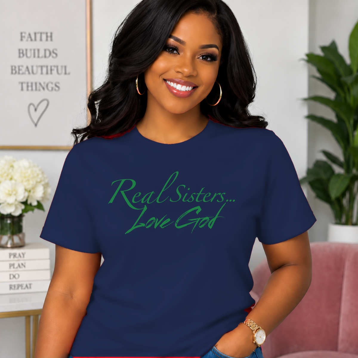 Model wearing Navy Real Sisters Love God T-shirt with Green lettering, crisp original logo