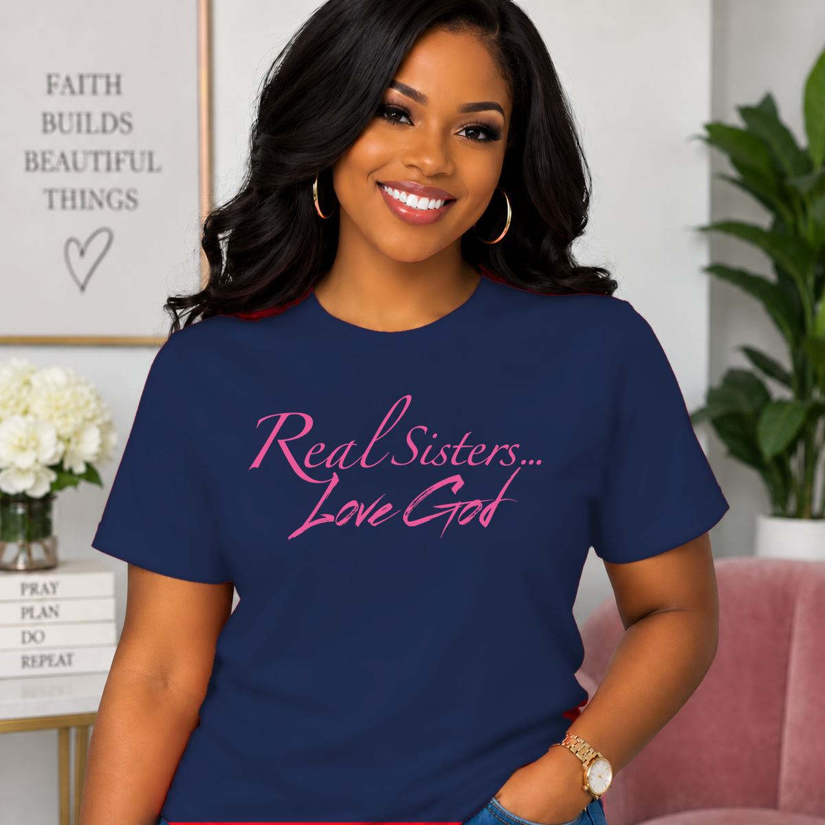 Model wearing Navy Real Sisters Love God T-shirt with Pink lettering, crisp original logo