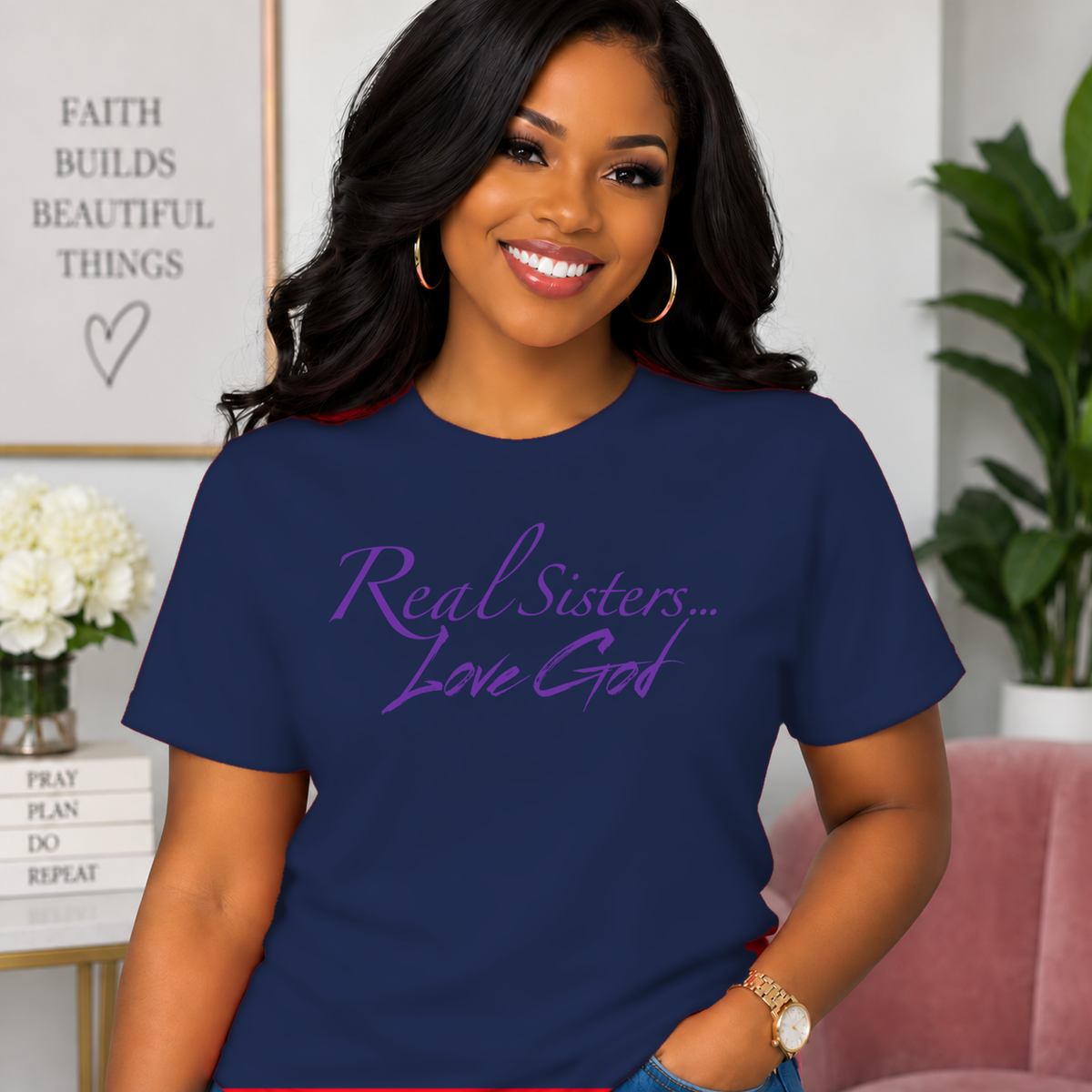 Model wearing Navy Real Sisters Love God T-shirt with Purple lettering, crisp original logo