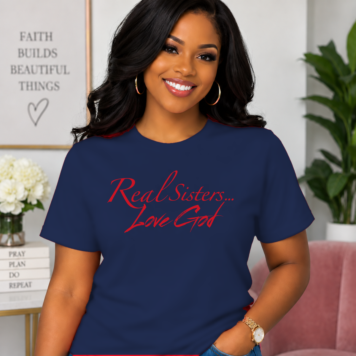 Model wearing Navy Real Sisters Love God T-shirt with Red lettering, crisp original logo