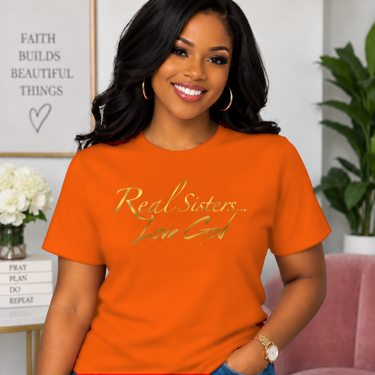 Model wearing Orange Real Sisters Love God T-shirt with Metallic Gold lettering, crisp original logo