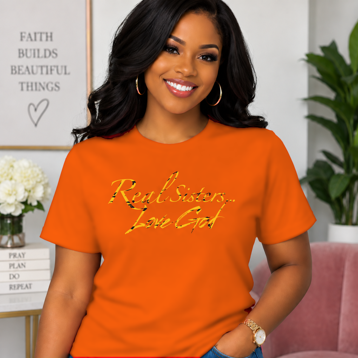 Model wearing Orange Real Sisters Love God T-shirt with Tiger Print lettering, crisp original logo