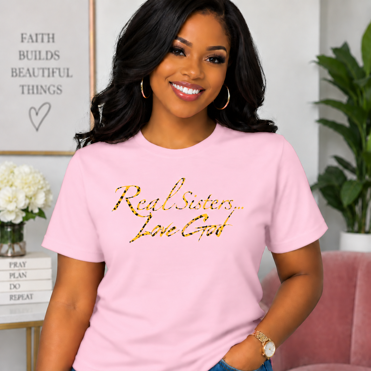Model wearing Light Pink Real Sisters Love God T-shirt with Jag Print lettering, crisp original logo