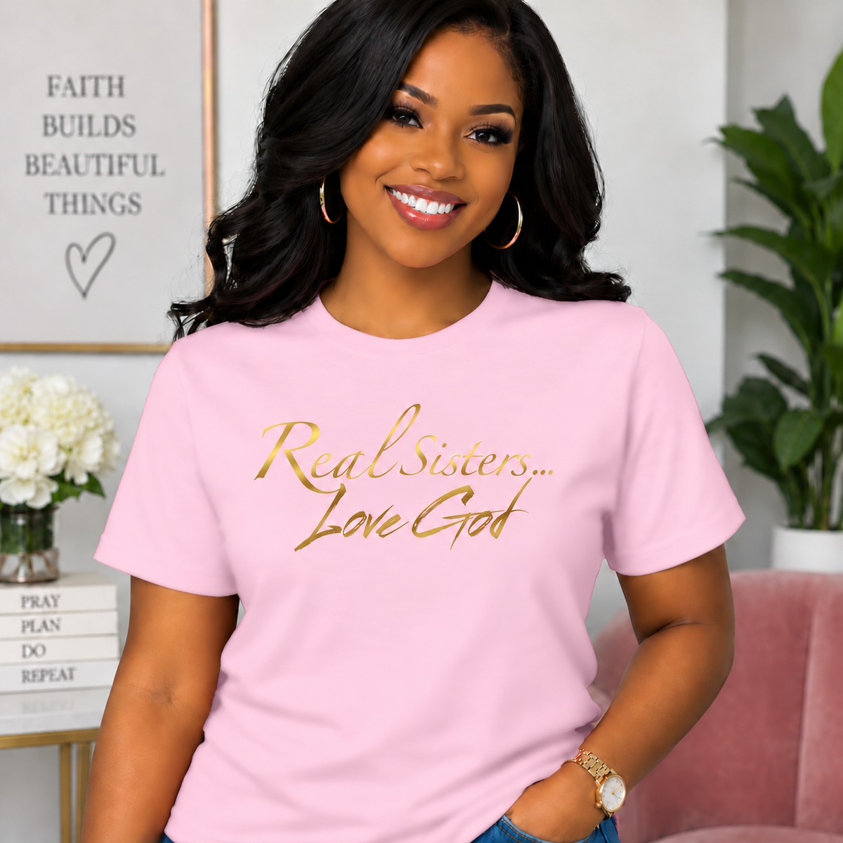 Model wearing Light Pink Real Sisters Love God T-shirt with Metallic Gold lettering, crisp original logo