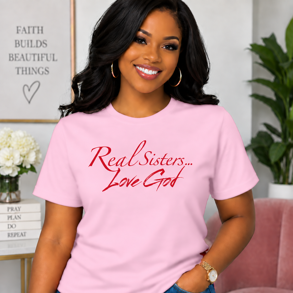 Model wearing Light Pink Real Sisters Love God T-shirt with Red lettering, crisp original logo