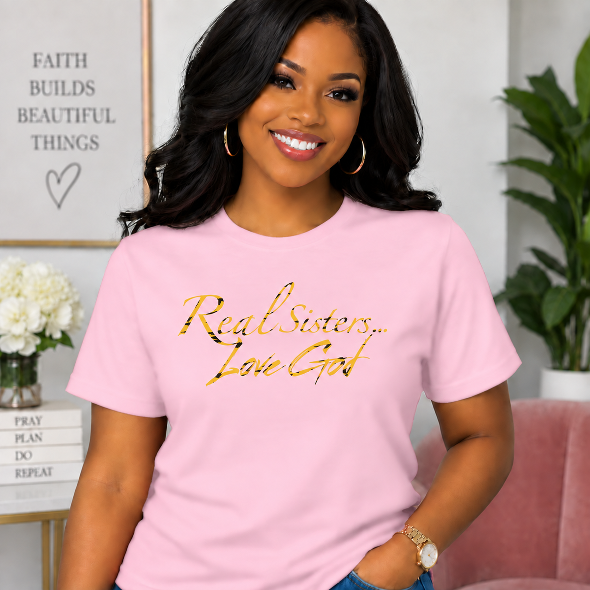 Model wearing Light Pink Real Sisters Love God T-shirt with Tiger Print lettering, crisp original logo