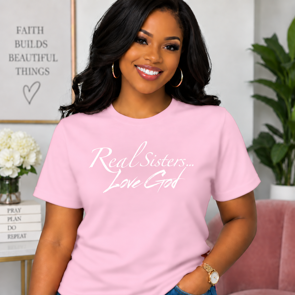 Model wearing Light Pink Real Sisters Love God T-shirt with White lettering, crisp original logo