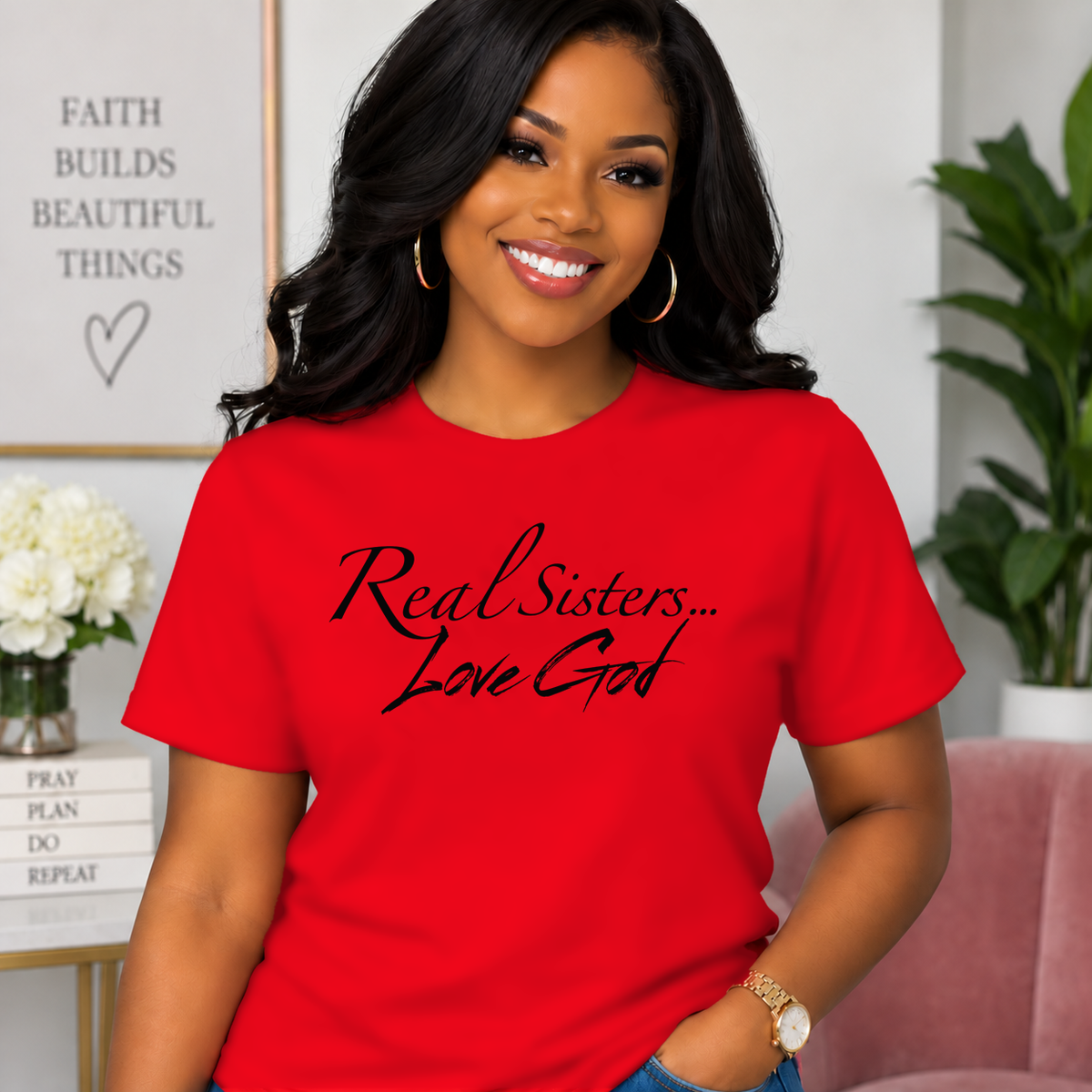Model wearing Red Real Sisters Love God T-shirt with Black lettering, crisp original logo