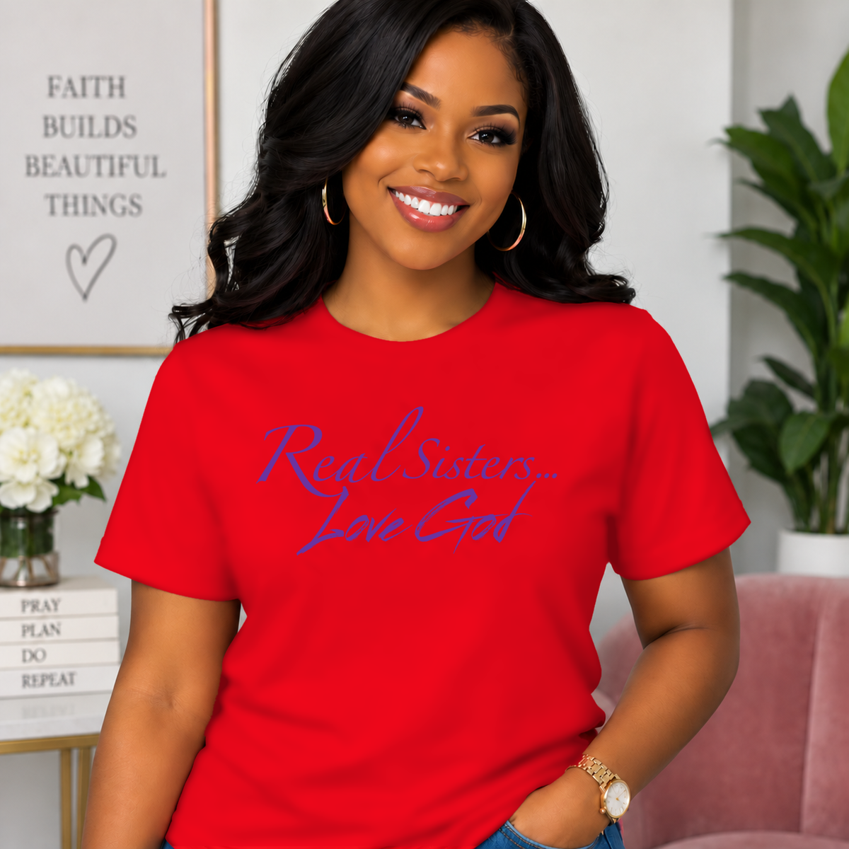Model wearing Red Real Sisters Love God T-shirt with Purple lettering, crisp original logo